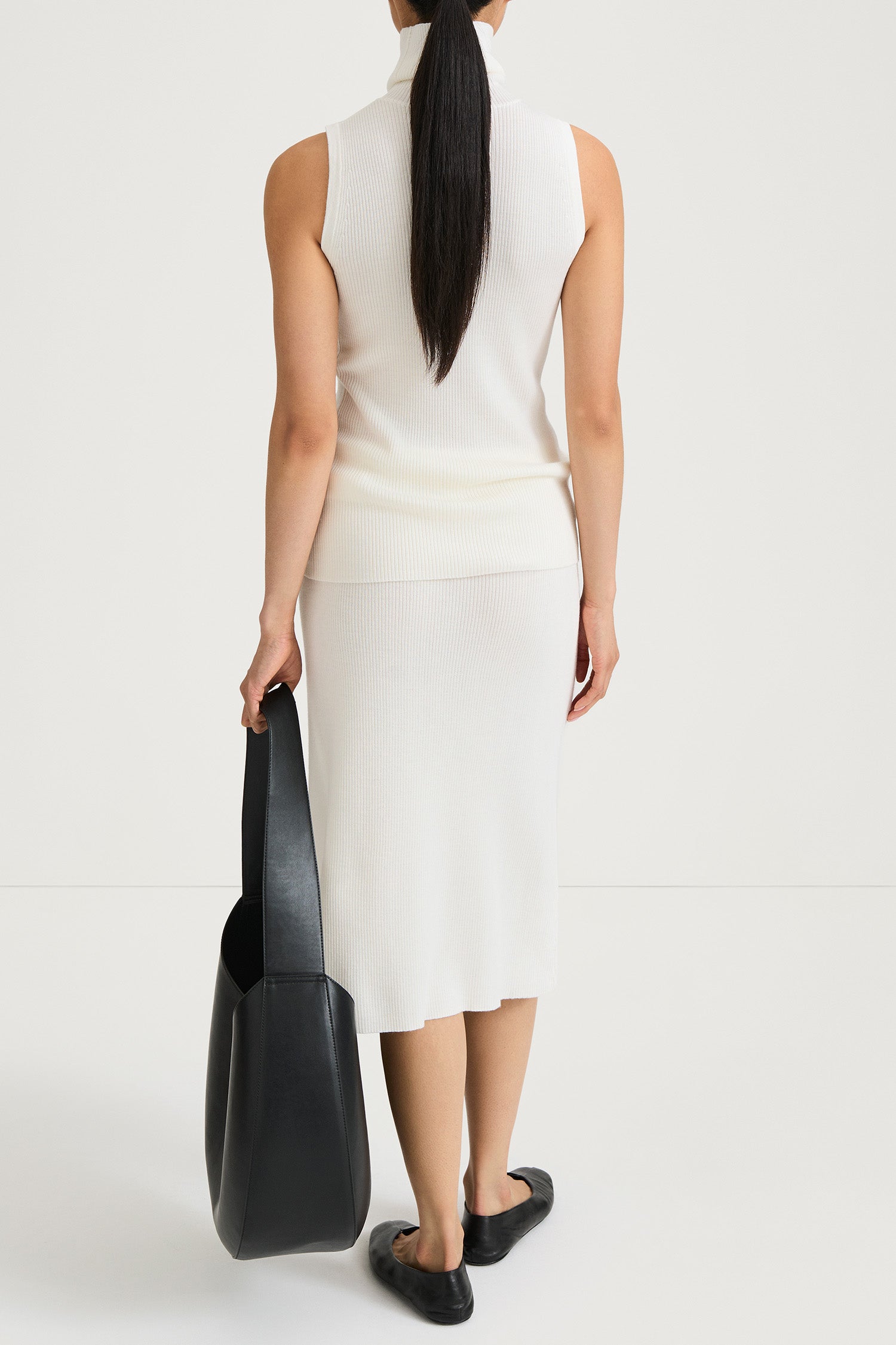 Pearla ribbed knit midi long skirt merino wool cream stylein model image back