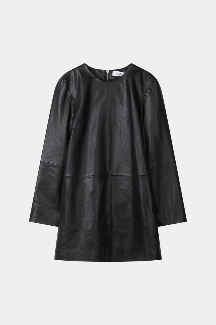 A black leather long-sleeve dress with a relaxed, oversized fit and a round neckline, shown against a plain light gray background.
