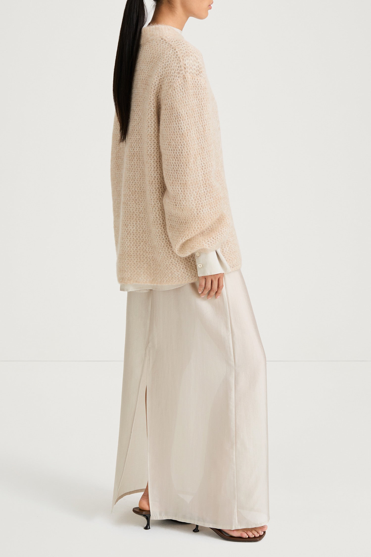 Beige knitted sweater stylein nella side model image