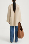 Beige wool coat stylein tara back model image