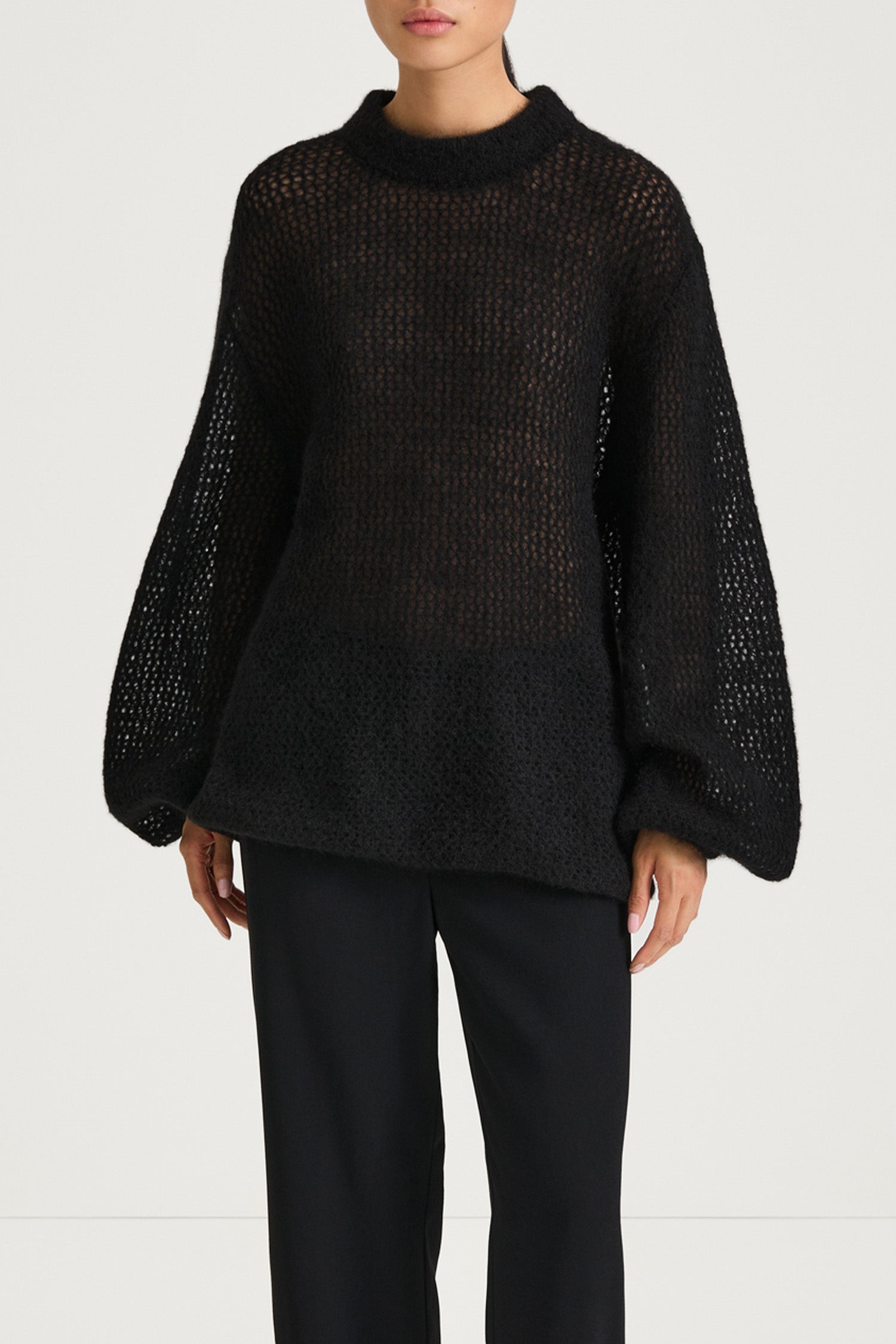 Black knitted sweater stylein nella front close up model image