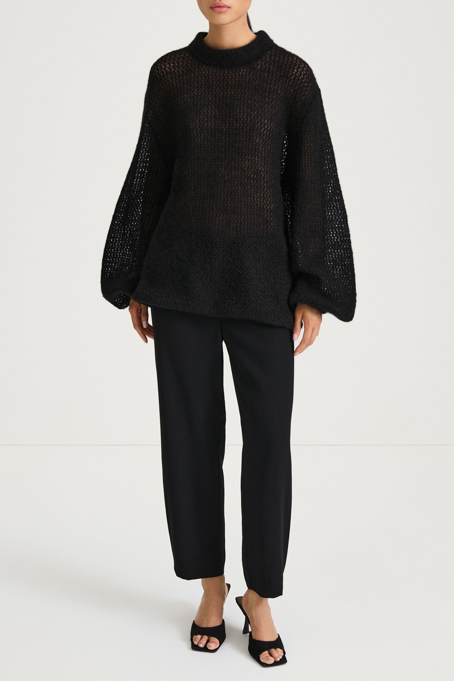 Black knitted sweater stylein nella front model image