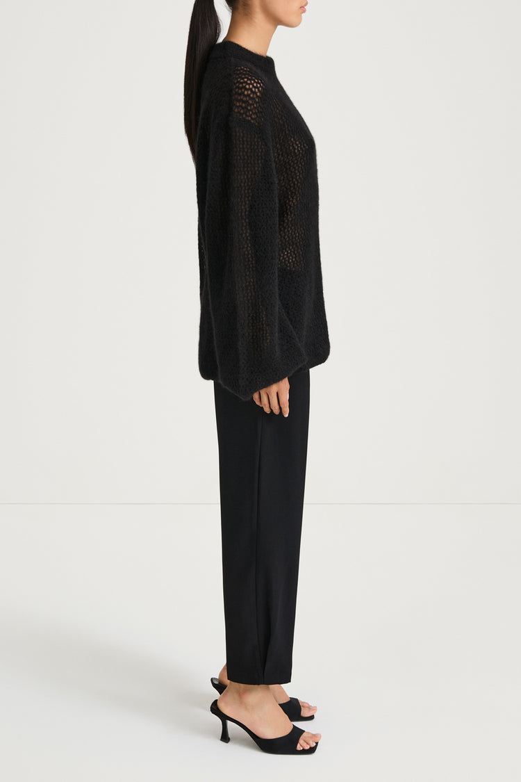 Black knitted sweater stylein nella side model image