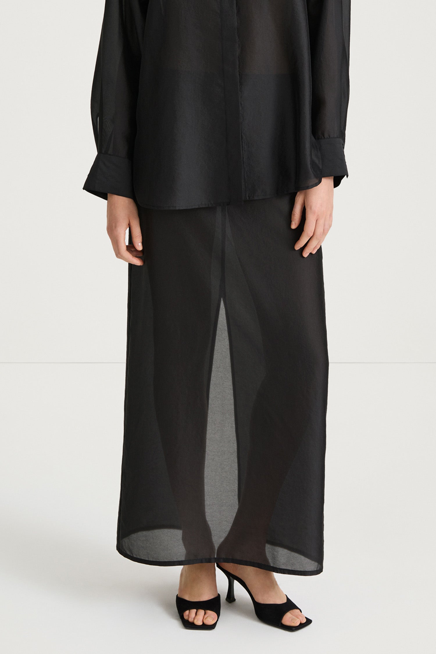 Black maxi transparent skirt stylein front  close up model image