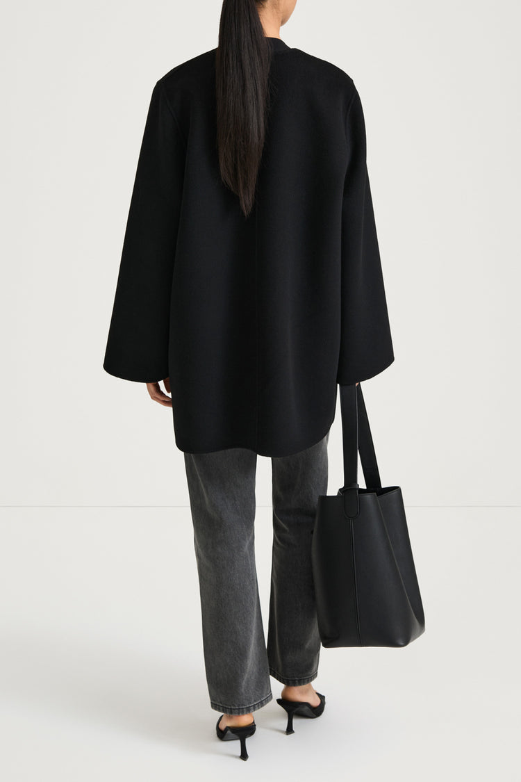 Black wool coat stylein tara back model image