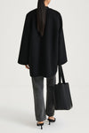 Black wool coat stylein tara back model image