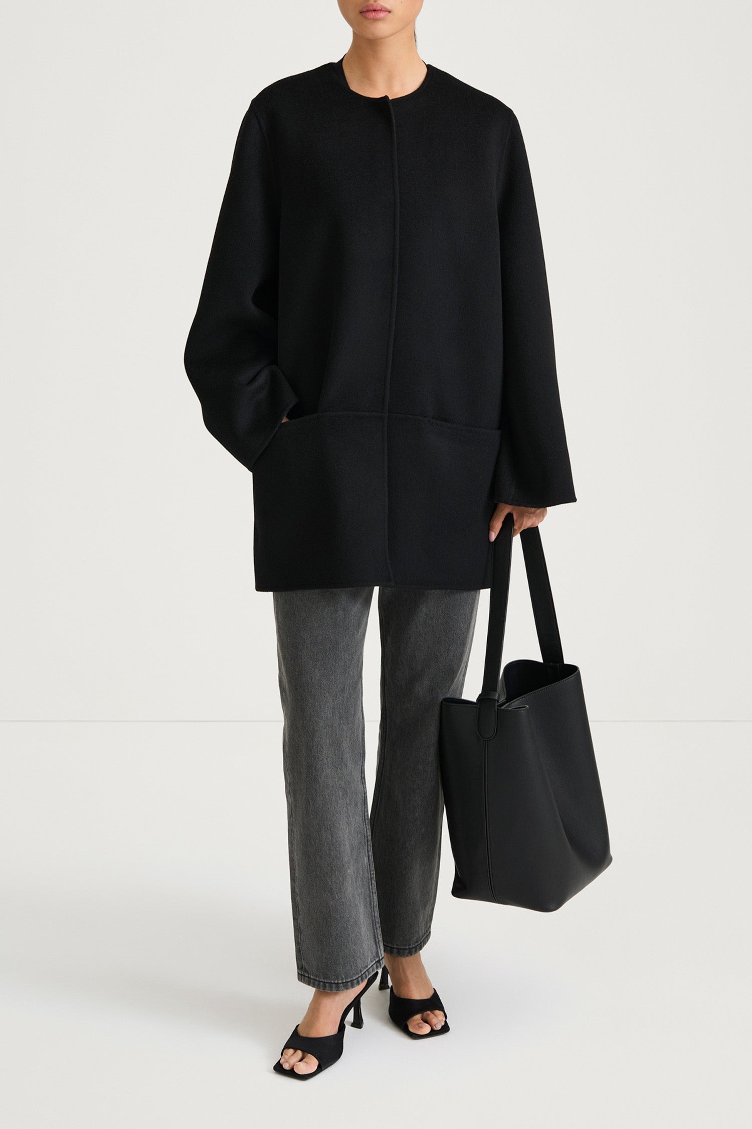 Black wool coat stylein tara front model image