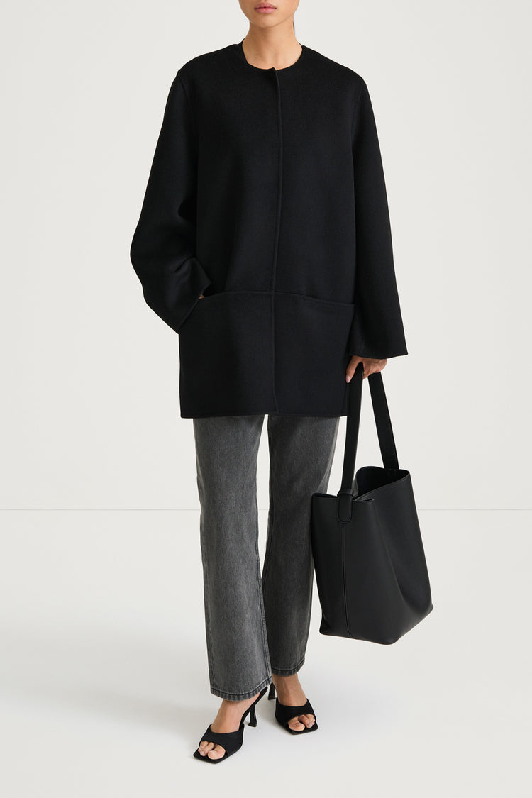 Black wool coat stylein tara front model image