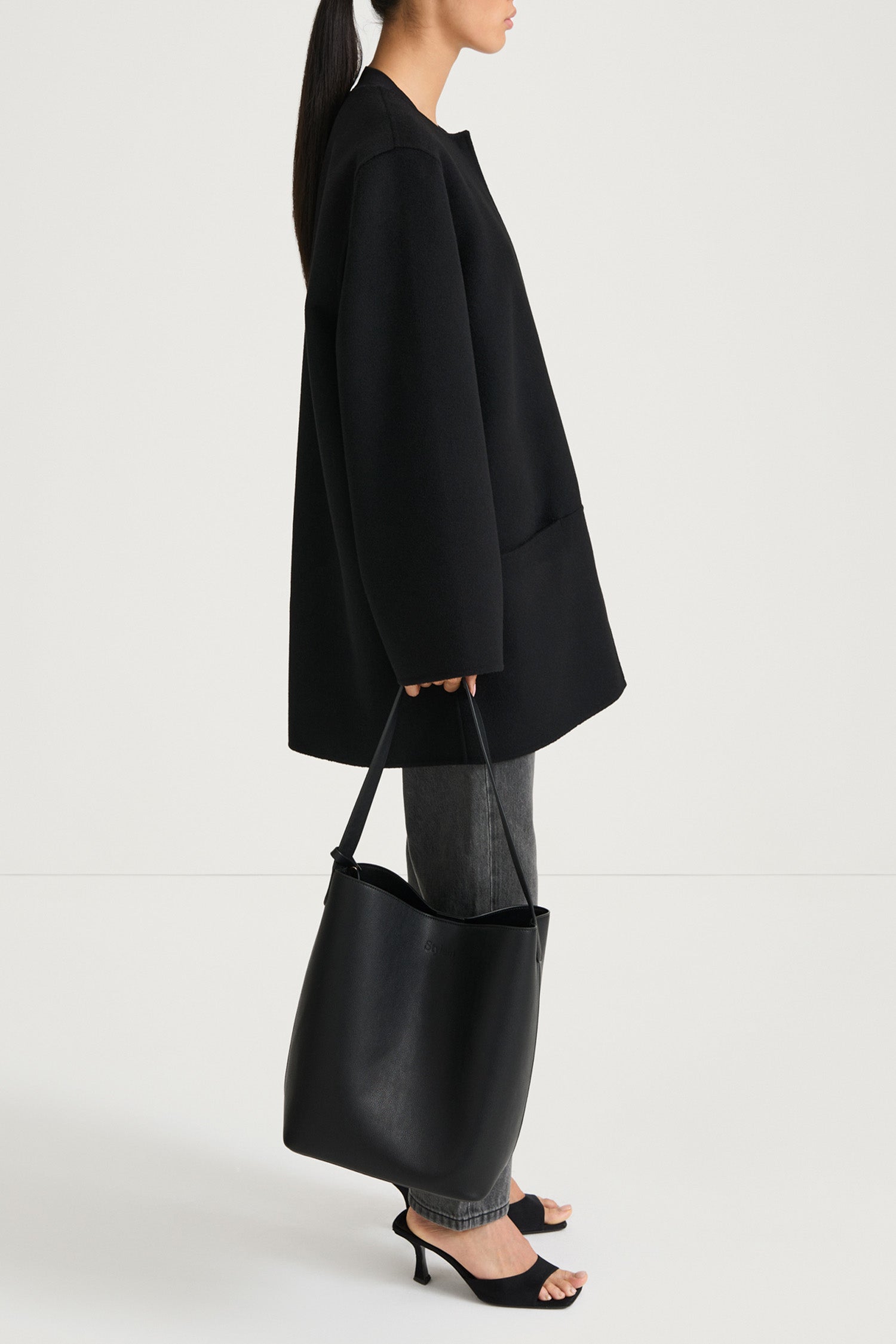 Black wool coat stylein tara side model image