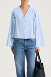 Light blue v-neck shirt stylein jaylene front  close up model image