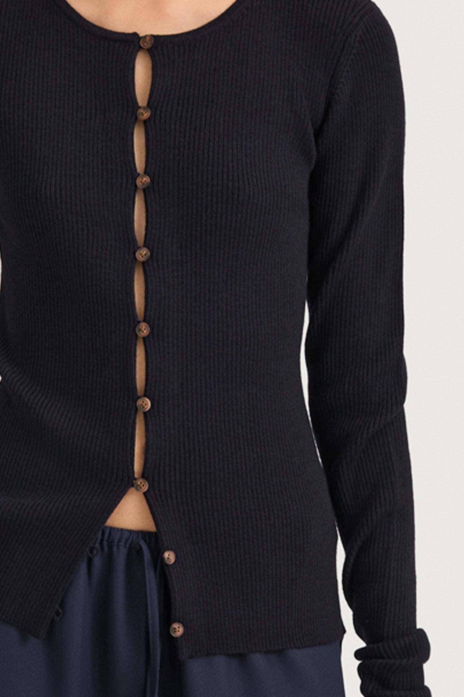 Navy buttoned cardigan stylein hamani front close up model image