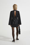 Bernalda dress shiny fabric short semi fitted  collar stand neckline thin shoulder pads flared full length sleeves black stylein back image