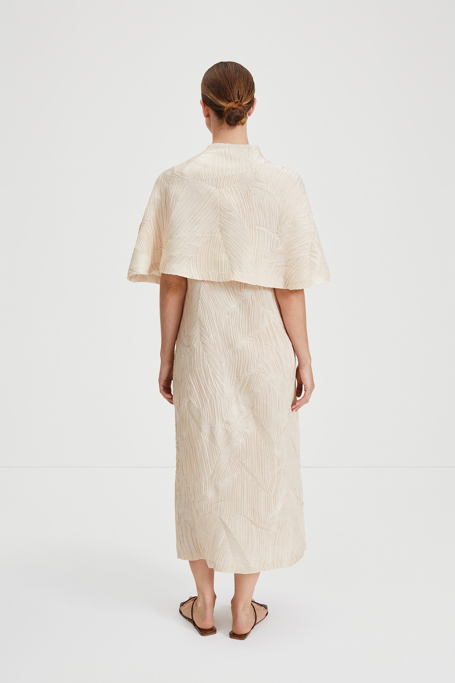 Ida cape crushed plisse fabric built up neckline darts front and back sand stylein back image