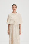 Ida cape crushed plisse fabric built up neckline darts front and back sand stylein front image