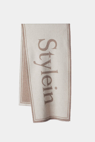 Thalia is a wide signature scarf with two big Stylein logos centered on each side.