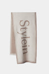 Thalia is a wide signature scarf with two big Stylein logos centered on each side.